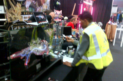 A Dutch revenue agent questions an exhibitor during the raid on the High Times Cannabis Cup. (Photo by Dana Larsen).